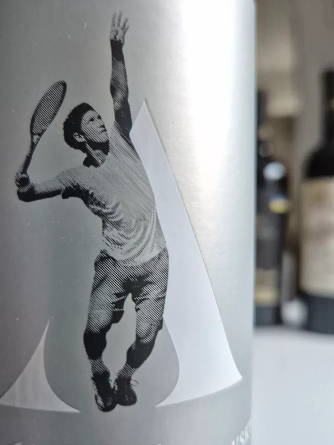 Detail shot of the label of the Saperavi Ace from Stakhovsky Winesfeaturing a tennis player in action. 🎾